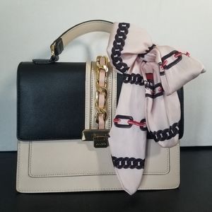 Aldo purse cream color, with black, gold, & very pale blush pink accents.